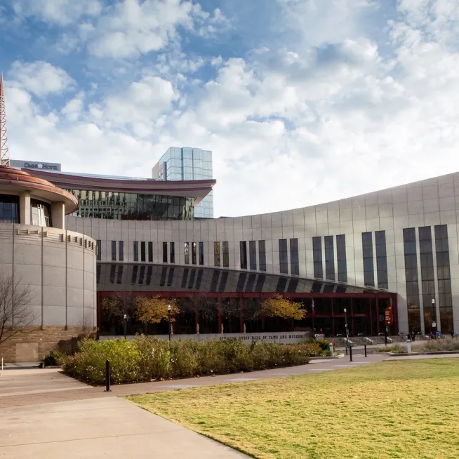 A landscape photo of the front of the Country Music Hall of Fame and Museum